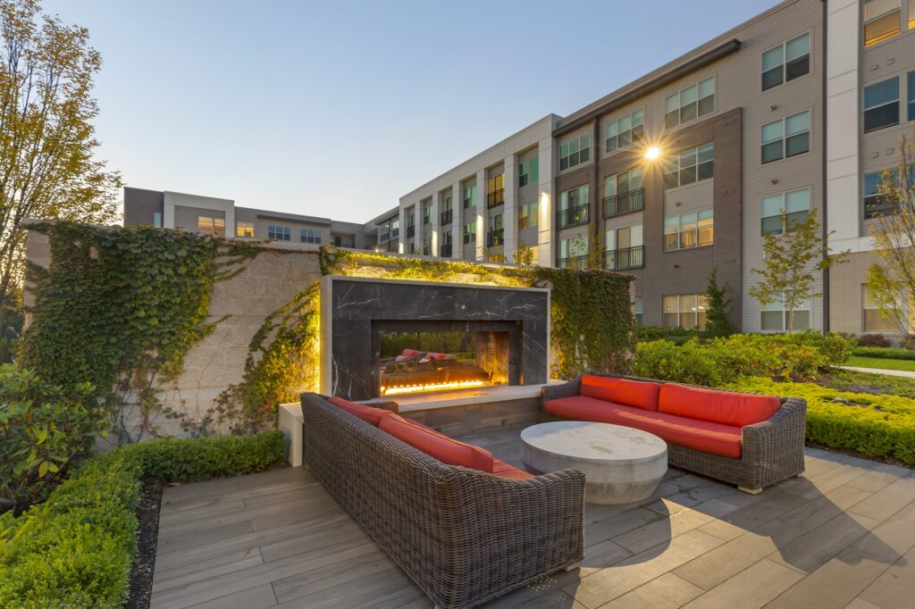 Afternoon shot showing outdoor seating for the clubhouse courtyard with fire pit